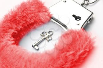 Red fluffy handcuffs with key