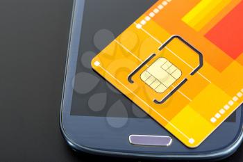 Yellow sim card on the phone against grey background