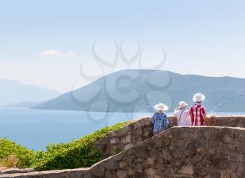 Tourists are enjoying the view of sea from mountain