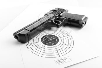 Closeup of paper target and pistol