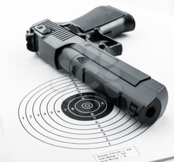 Closeup of paper target and gun