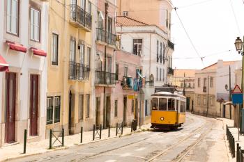 Old tram on narrow european street 