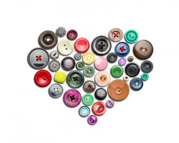 Many colorful buttons in heart shape isolated on white