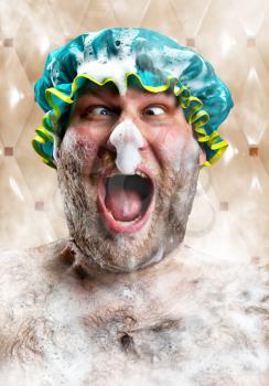 Bizarre man with soap foam on nose taking bath