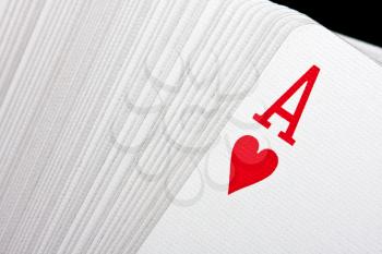 Playing cards with ace of hearts on top