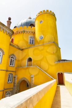 Beautiful yellow castle with towers against the sky