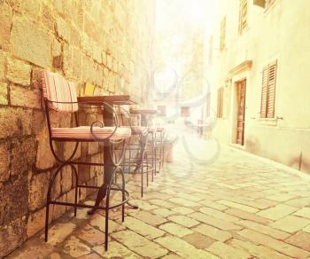 Outdoor cafe chairs in old lane of Montenegro