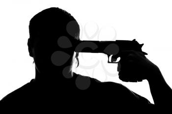 Silhouette of man shooting himself. Isolated on white