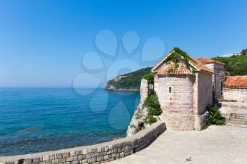 Beautiful view of blue sea with old brick tower