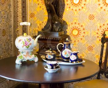 Beautiful vintage tea set on the wooden table