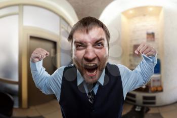 Businessman screaming at the office