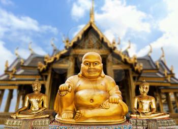 Statuette of sitting golden Buddha