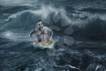 Man in the sea with life ring in the storm
