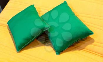 Colorful green pillows on hotel bed
