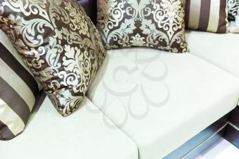 Velvet pillows on the white sofa closeup