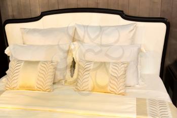 White beautiful pillows on hotel bed