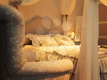 Nice luxury big bed with pillows in a bedroom