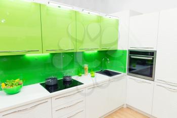 Modern green kitchen interior shot with studio light