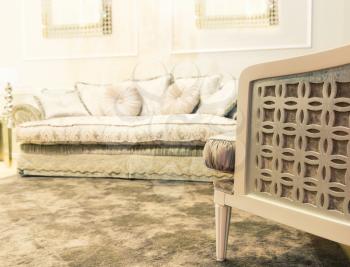 Luxury beige interior with nice white sofa