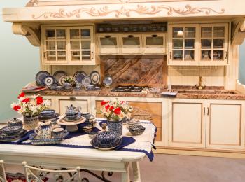 Luxury kitchen made from light wood with kitchen tools