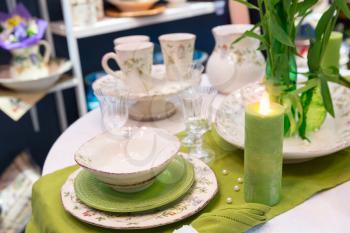 Served with a kitchen tools on the green table with glases and plates