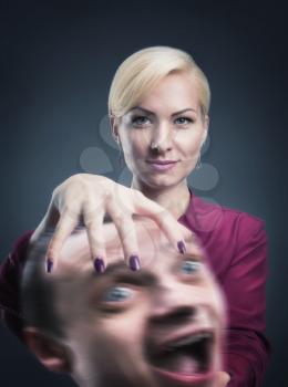 Serious psychic with stressed head in her hand
