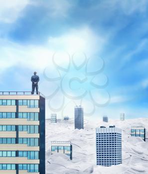 Businessman on the roof is looking at the horizon over the city sinking in paperwork 