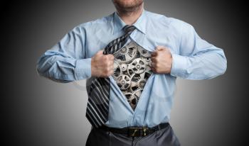 Businessman with gears inside his shirt