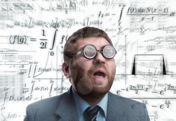 Professor in glasses thinking over math formulas