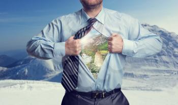 Businessman with mountains inside his shirt