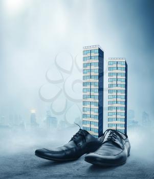 Office buildings in the male classic shoes against the cityscape