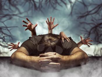 Sleeping man in halloween with many creepy hands behind