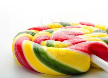 Colorful sweet lollipop closeup isolated on white background