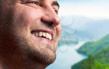 Close up of smiling man in mountains