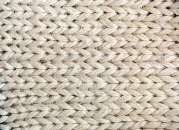 Close up of beige knitted texture 