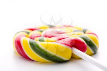 Macro of colorful sweet lollipop on white background