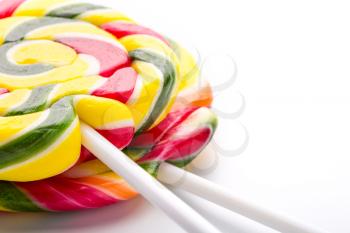 Closeup of colorful sweet lollipops isolated on white