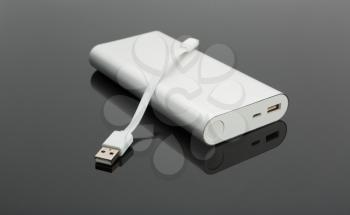 Power bank and a short cable on the table