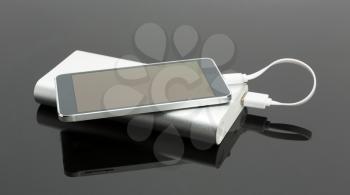 External power bank connected with a smart phone 