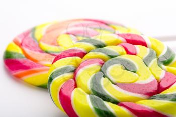 Closeup of colorful sweet lollipops on white