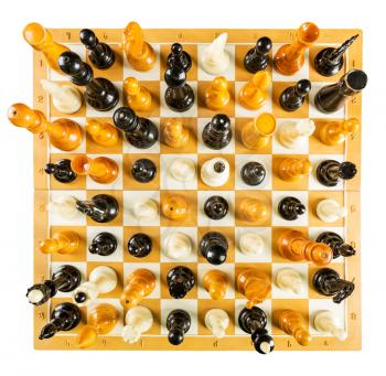 Up view of chess figures standing on the board isolated