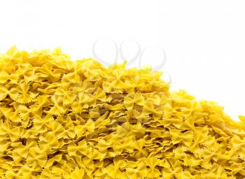 Heap of bowtie pasta isolated on white background