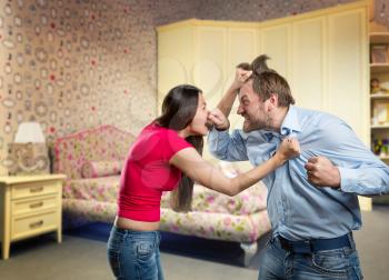 Man and woman are fighting at home