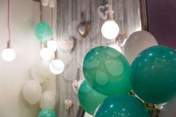 Balloons in festive decorated room close up