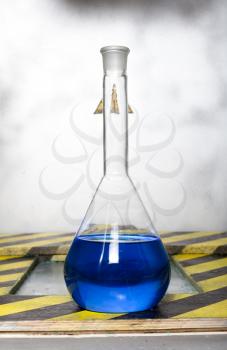 Chemical flask with blue reagent