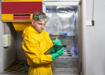 Man in protective suit working in the lab