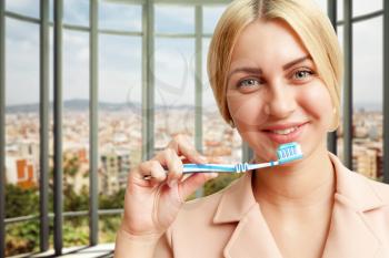 Portrait of smiling woman with tooth brush