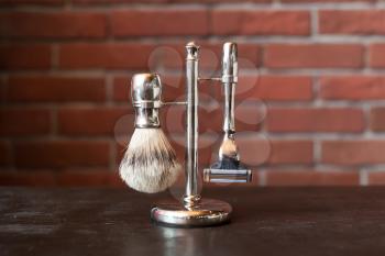 Machine for shaving and brush on the stand
