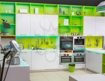 Modern kitchen interior with green colored furniture