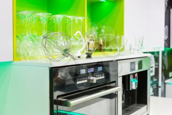 Professional kitchen interior with green furniture and modern equipment